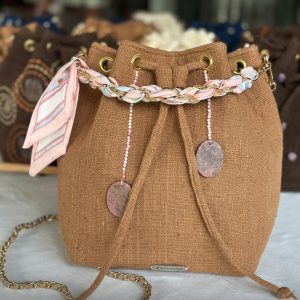 The tan (light brown) with pink stones