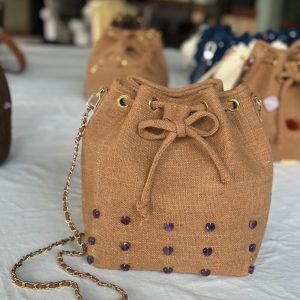 The brown bag with heart shaped purple stones