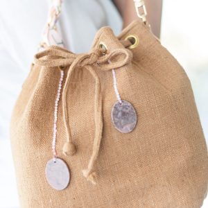 The Tan (light Brown) with pink stones.