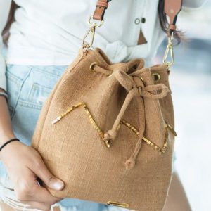 The Light Brown bag with the golden beads.